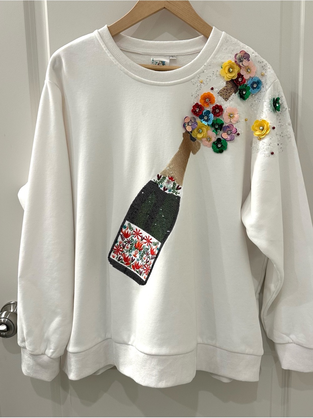 Queen of Sparkles Popping Champagne Sweatshirt w/Floral Label in White. Size L
